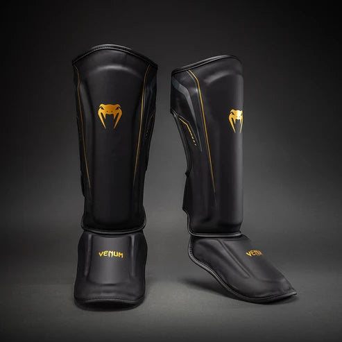 Espinilleras Venum Streamline - Negro/Oro